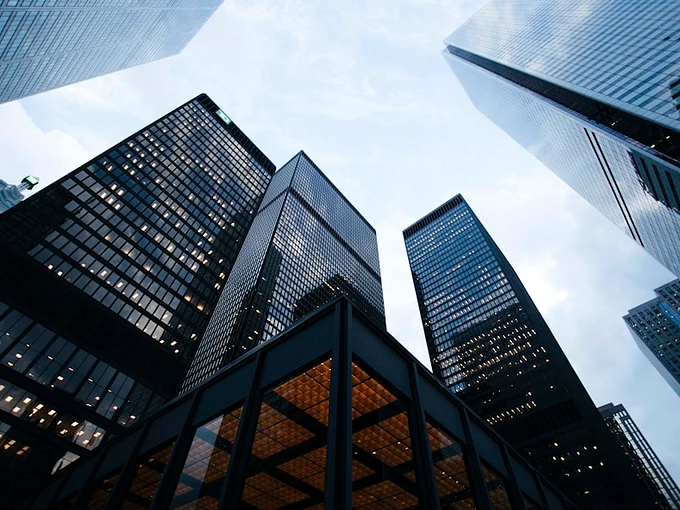 Modern architectural glass skyscraper representing scalable recruitment
